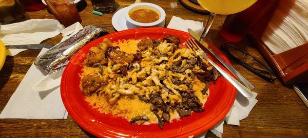 El Toriado was delightful with grilled chicken, steak, shrimp, and bacon served over rice, covered with cheese dip and tortillas.