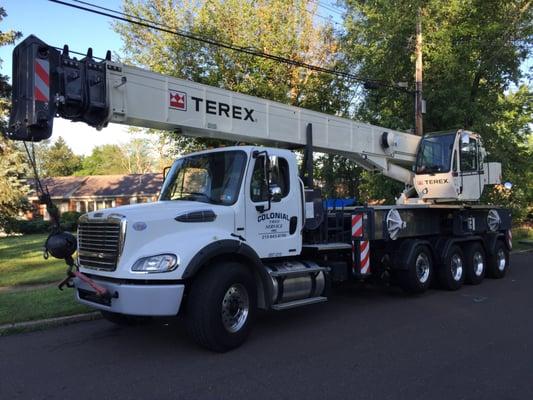 Our 50 ton 5 axle crane getting ready to life some big trees.