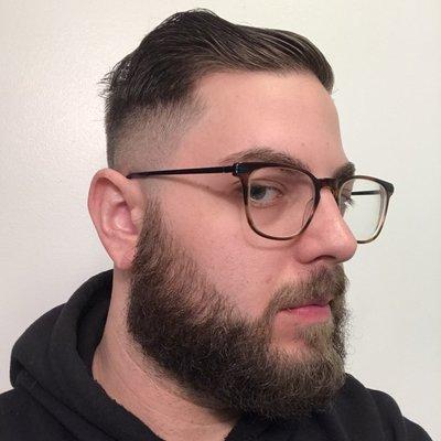 High skin fade with slick back combover