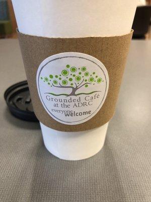 Grounded Cafe logo on the cup holder.