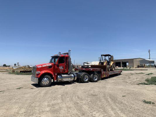 Heavy machinery transport available 24/7. Reliable, Efficient and on time EVERY time. Call now to schedule your next heavy transport!