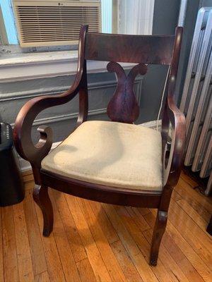 Dining chair "Before" picture. Notice how sad the seat is and how worn the armrests are.