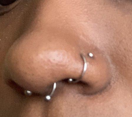 septum and double nose piercing.