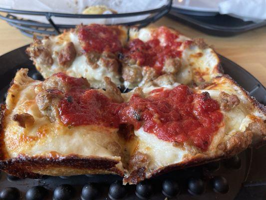 Individual size deep dish sausage pizza