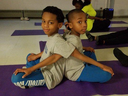 Partner poses at Family Yoga Night with Donna from CHGO YOGA CO-OP