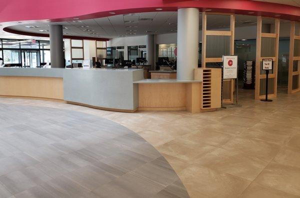 Bunker Hill Community College large reception desk area custom built by National Millwork.