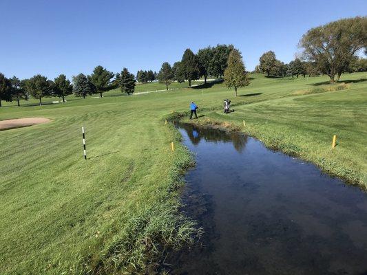 My golf partner trying to hit out of water at Southern Hills.