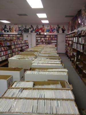 Comic section there are more boxes full under table