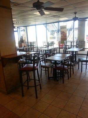 Seating area with windows looking to the parking lot and gulf.