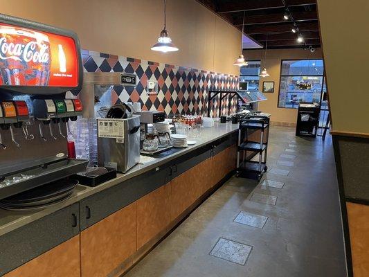 The drink and salad bar area as viewed from the restroom area entrance.