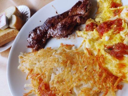 Steak and eggs with a side of sourdough toast.