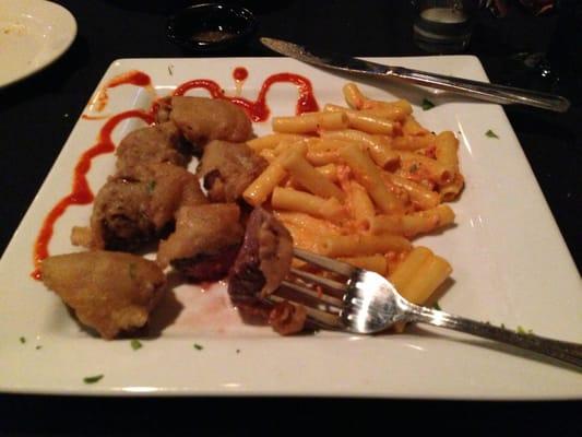 Specially created deep fried medium rare steak medallions with ziti pasta and siracha sauce.