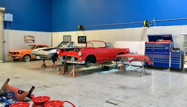 Restoration of two classics going on side by side, a Ford Thunderbird and a Chevy Corvette