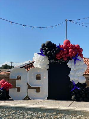 Marquee number 39 black backdrop with balloons