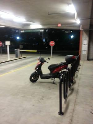 There's free motorcycle and scooter parking inside the 6th street exit.