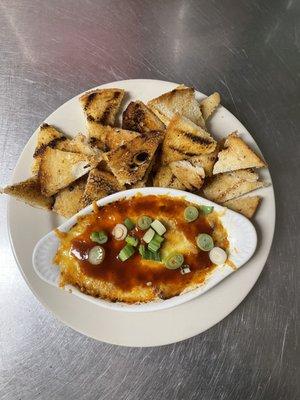 Brisket Dip with toast points. This dip has a little spice from the BBQ rub but the sweet from the house citrus BBQ sauce.