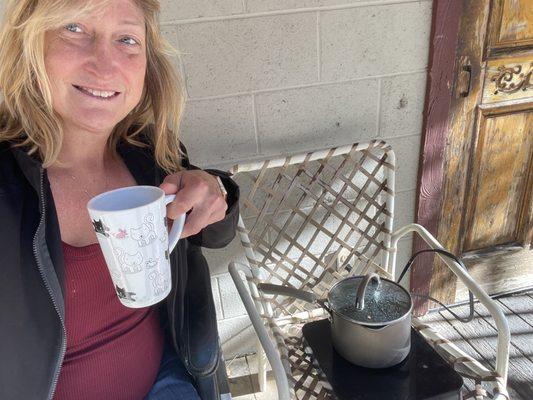 Making some coffee on the front porch, for they have plenty of power and enjoying a slow Sunday morning