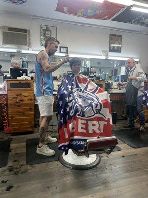 Working with his barber.