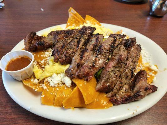 Chilaquiles with carne asada and eggs