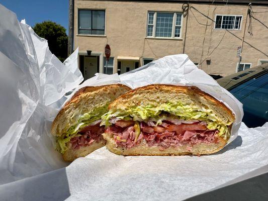 Hot pastrami sandwich on soft roll