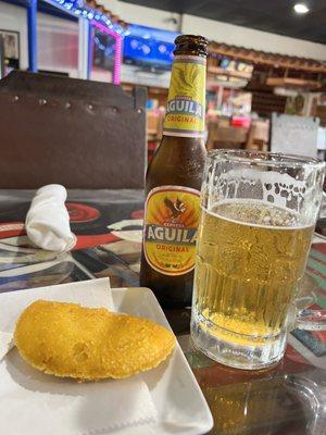 Empanada de carne with Águila Beer