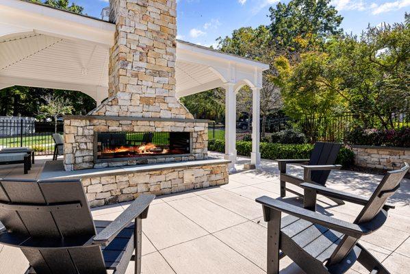 Outdoor fireplace with lounge seating