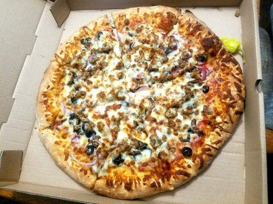 XL pizza with mushrooms, onion, black olives, ground beef.