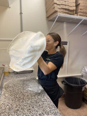 Brenda making a pizza