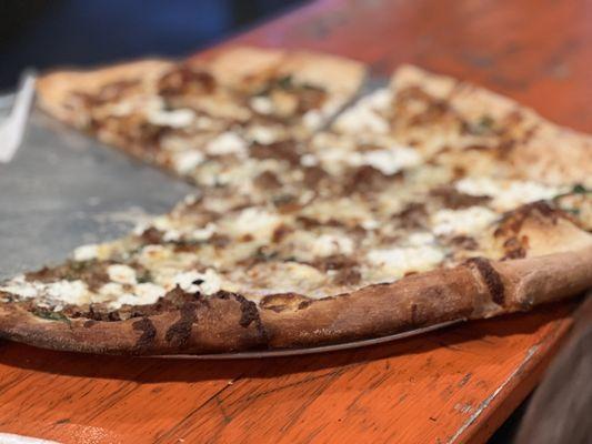 Fennel sausage, arugula and ricotta cheese pizza