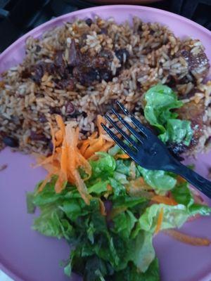 Oxtails, rice and peas and plantains with salad