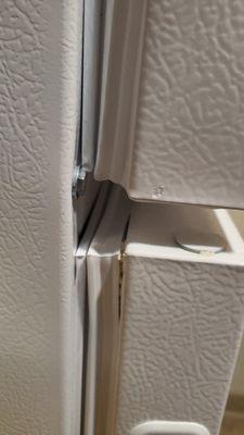 The maintenance guy said there is nothing wrong with the refrigerator. The doors are bent and the top has a dent by the door hinge.