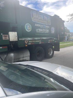 The trash truck w/ information of the business