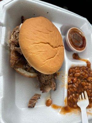 Brisket sandwich, baked beans, & a cup of bbq sauce (H for hot).