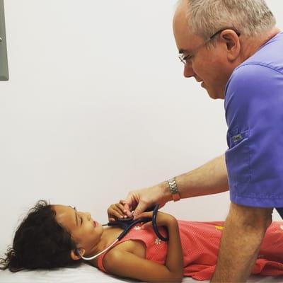 Asked if she could use Dr. Thompson's stethoscope to listen to her heartbeat, without hesitation he plopped them on her ears