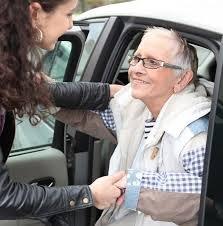 Janis assists Majorie, who prefers to ride in the back seat.