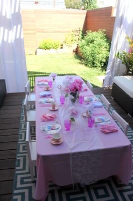 6 ft childrens table, six childrens chairs and pink linen.