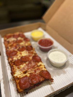 Deep dish square pepperoni with ranch, marinara, and garlic butter. We went a little crazy...