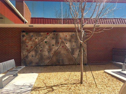 Kids rock climbing wall in the pocket park near Neptune Mountaineering.