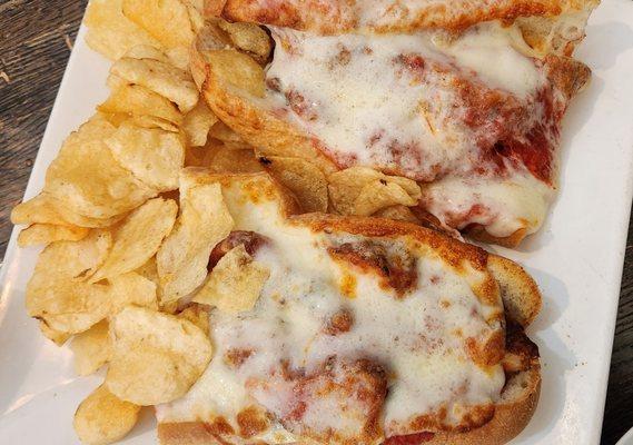 chicken Parm grinder served with chips