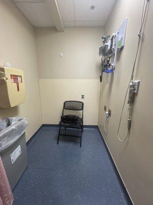 My treatment room in the ER. Single chair no arm rests