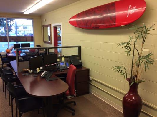 Welcome to our office! The board is there just in case surf's up on the North Shore!