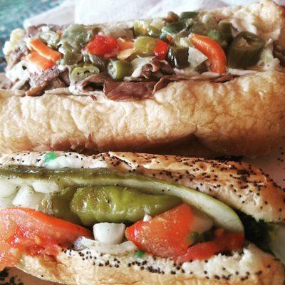 Italian beef sandwich with gardienera and cheese and a Chicago style hot dog.