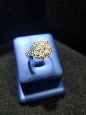 Beautiful 1.5 carat princess cut stone set in a radiant shape diamond halo. Perfect for engagement season!