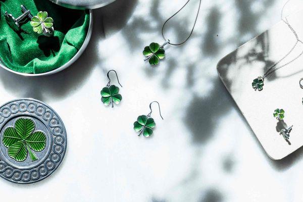 A selection of four-leaf clover-themed jewelry and accessories