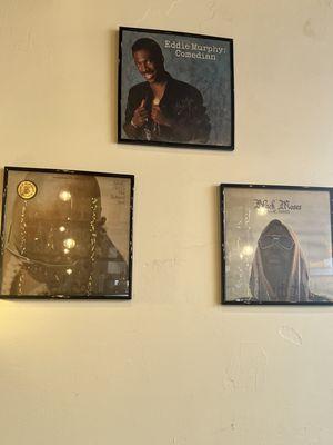 I love that the walls are decorated with classic record album covers.