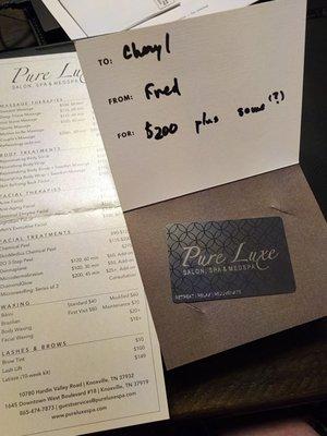 The gift card and price sheet from Pure Lux that I've never used because I can't get an appointment.