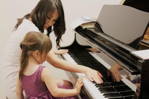 Mai and her student "making it rain" at 2014 Student concert