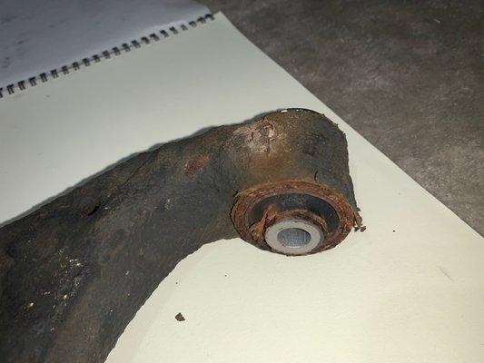 Corroded left lower control arm