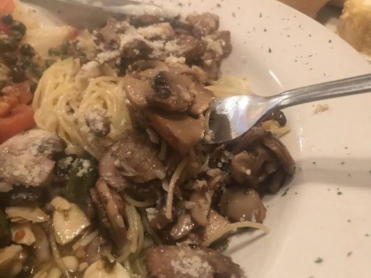 A big bite of cappelini in oil, touch of garlic, and some delicious mushrooms. A first for me. Great!