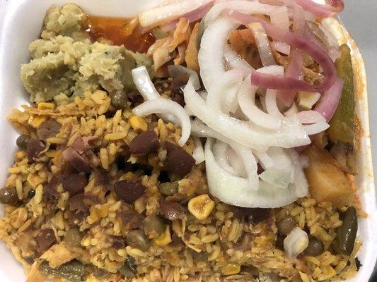 Fish, moro rice with gandules, mangu, red beans over the moro and onions.